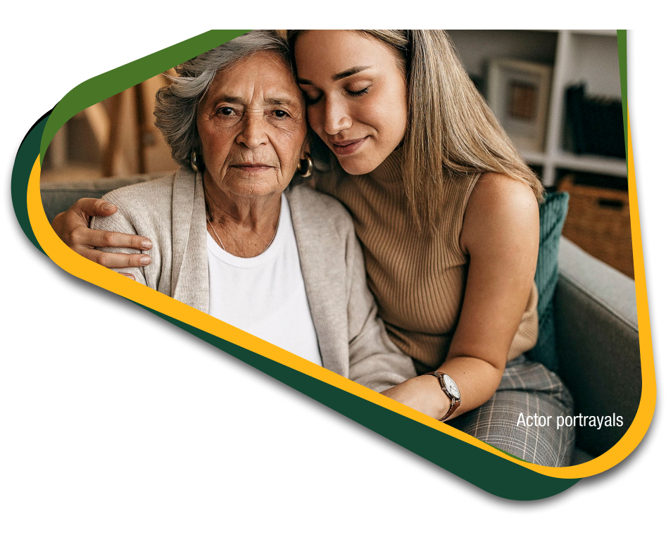 Caregiver embracing her loved one with agitation that may happen due to Alzheimer's disease