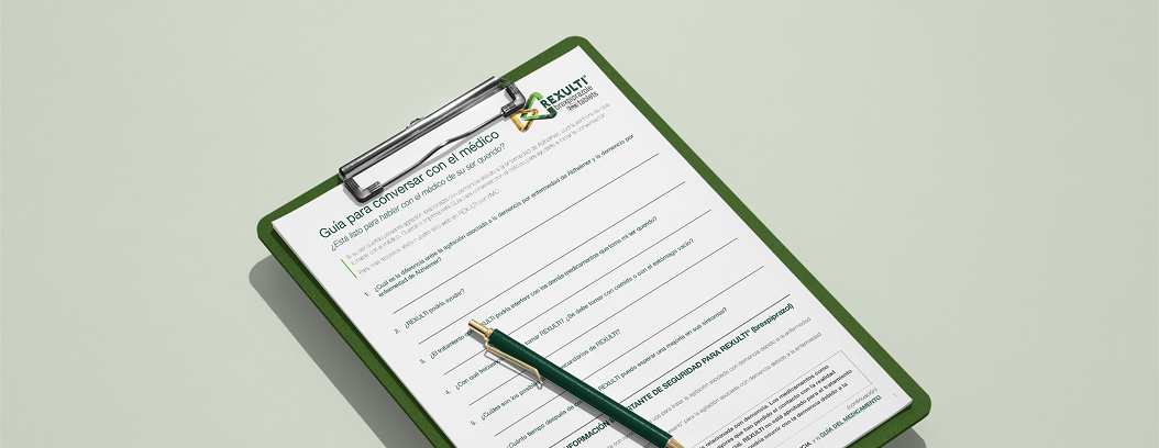 Guía de conversación con el médico en un portapapeles con bolígrafo