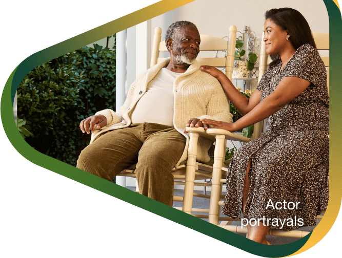 Actor portrayal of adult daughter sitting peacefully on the porch with her elderly father with agitation that may happen with dementia due to Alzheimer's disease.