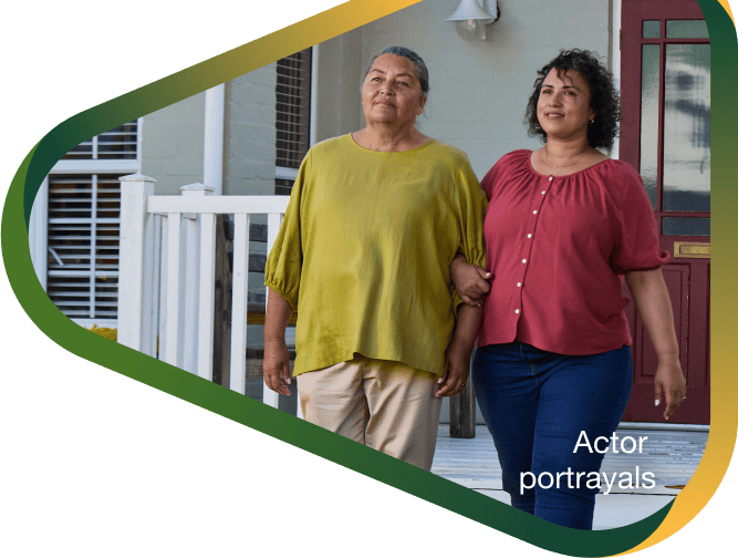 Actor portrayal of adult daughter walking outsite alongside her elderly mother with agitation that may happen with dementia due to Alzheimer's disease.