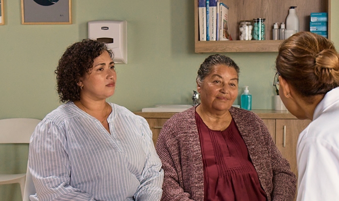 Actor portrayal of a caregiver and her loved one at the doctor's office discussing their treatment journey with agitation that may happen with dementia due to Alzheimer's disease.